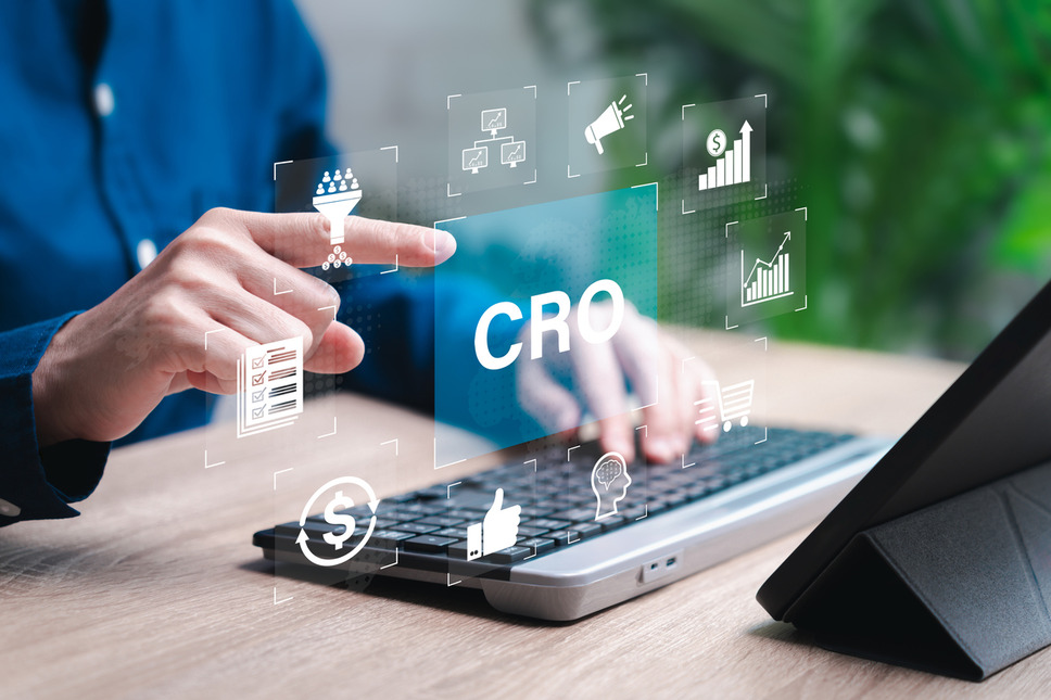 Business person using laptop to analyze conversion rate optimization (CRO) strategies for enhancing ecommerce performance