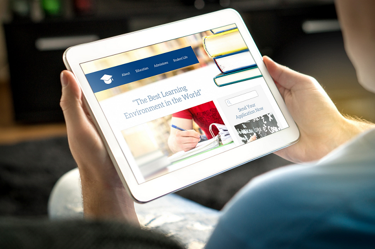 Person browsing an educational website on a tablet with the text