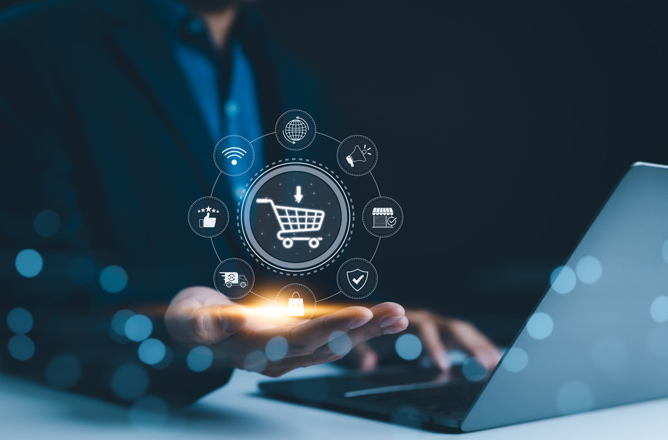 Person using laptop with icons of ecommerce strategies, signifying success with digital agency services for ecommerce growth