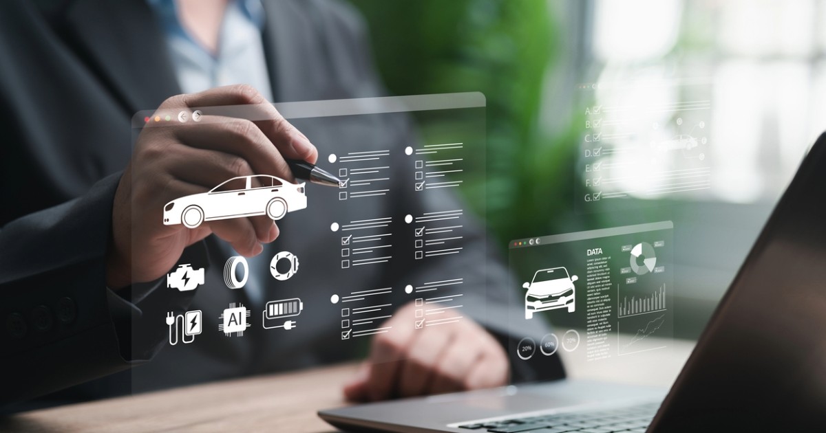 User reviewing digital automotive data, symbolizing web and marketing services for aftermarket parts and service providers