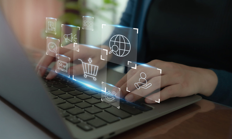 Professional using a laptop displaying ecommerce and digital marketing strategies and trends for customer engagement success
