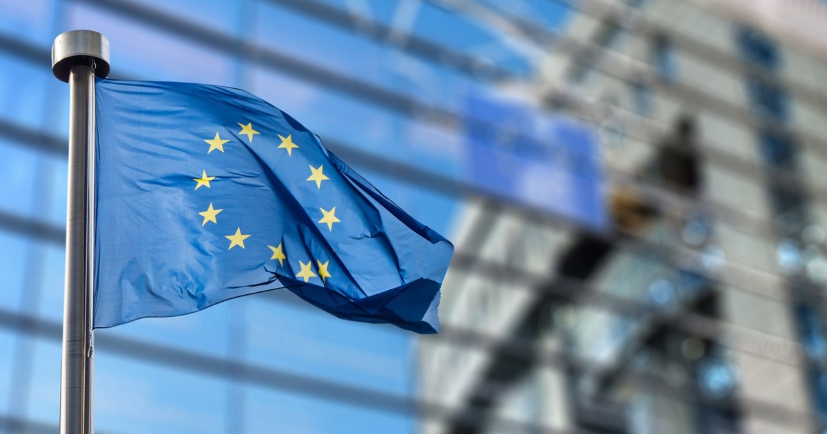 European Union flag waving, representing the 2025 Accessibility Act, ensuring equal access to goods and services for all