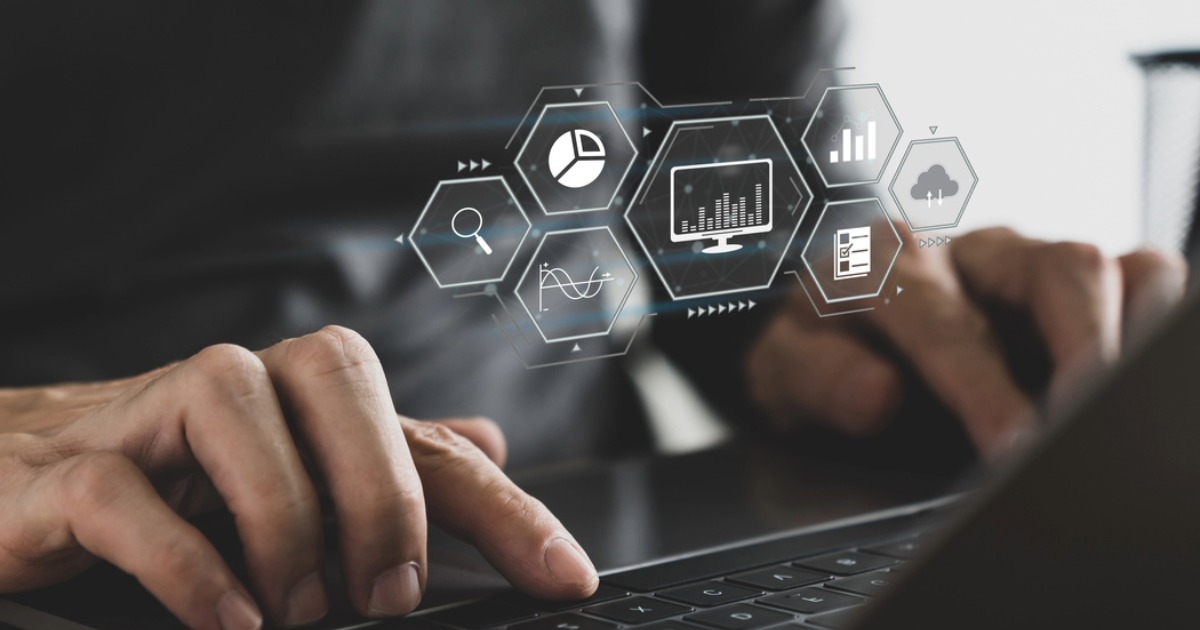 Professional using a laptop to review digital analytics tracking, data visualization, and reporting in Google Analytics 4