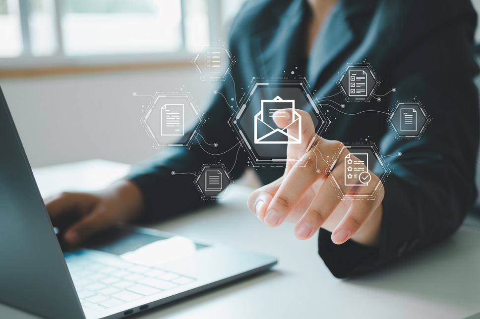 Professional leveraging email marketing features using laptop, symbolizing success with strategies for segmenting emails