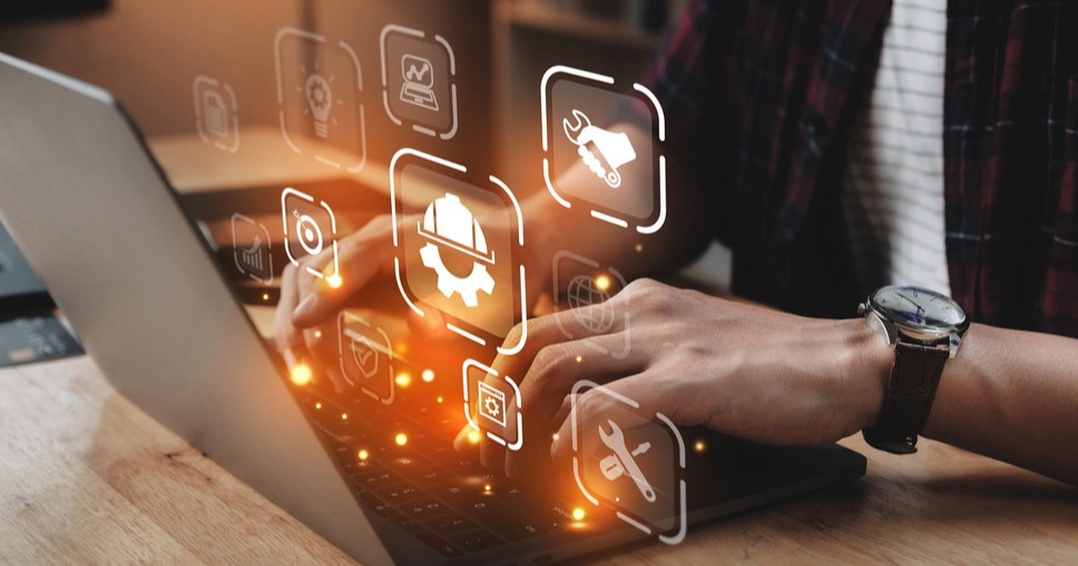 Professional using a laptop, leveraging website service support and Sitecore maintenance services for digital success