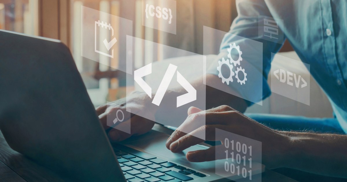 Developer coding on a laptop, representing success with app development agency services for native or cross-platform apps
