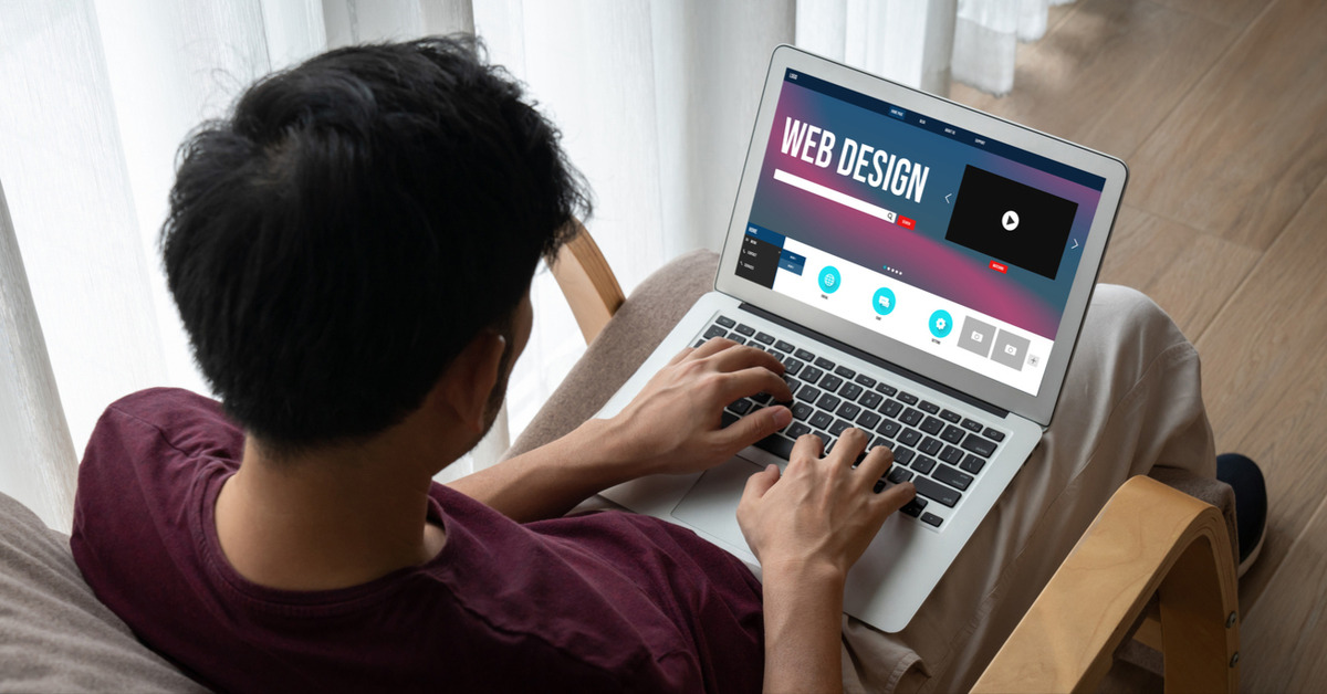 Person using laptop displaying animation and interactivity elements for user engagement on a web design interface