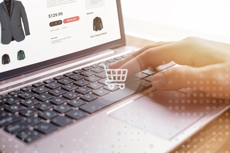 Person using laptop for online shopping, signifying success with personalized recommendations for ecommerce CX best practices