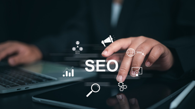 Professional interacting with digital marketing tools using laptop, representing success with social media strategies for SEO