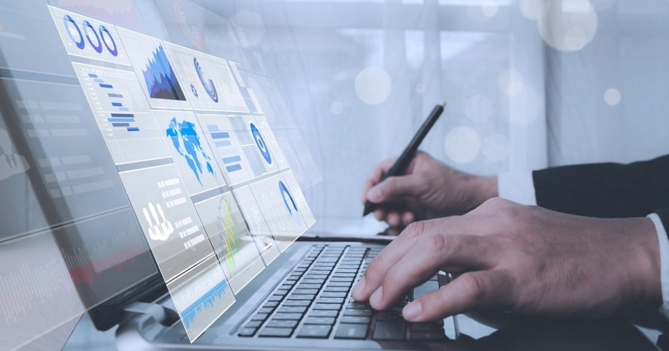 Professional with GA4 admin level access to analyze data exploring how to add a user to Analytics on a laptop