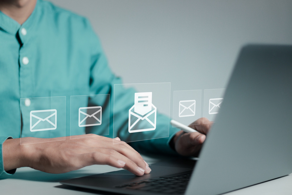 Person using laptop, interacting with email marketing features, highlighting success with digital marketing agency services