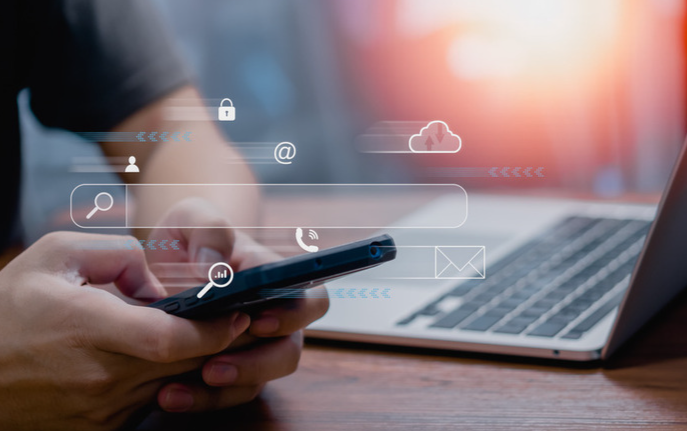 Person using digital device with site search ai functionality, representing business success with personalized experiences