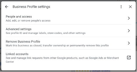 Screenshot of Google Business Profile settings menu with options for user profile management and linking accounts