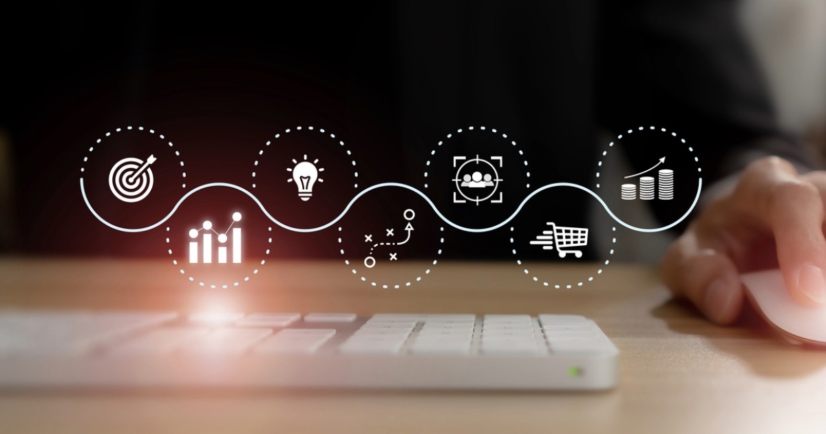 Person using a computer to explore B2B ecommerce strategies and trends for revenue growth across the digital commerce journey