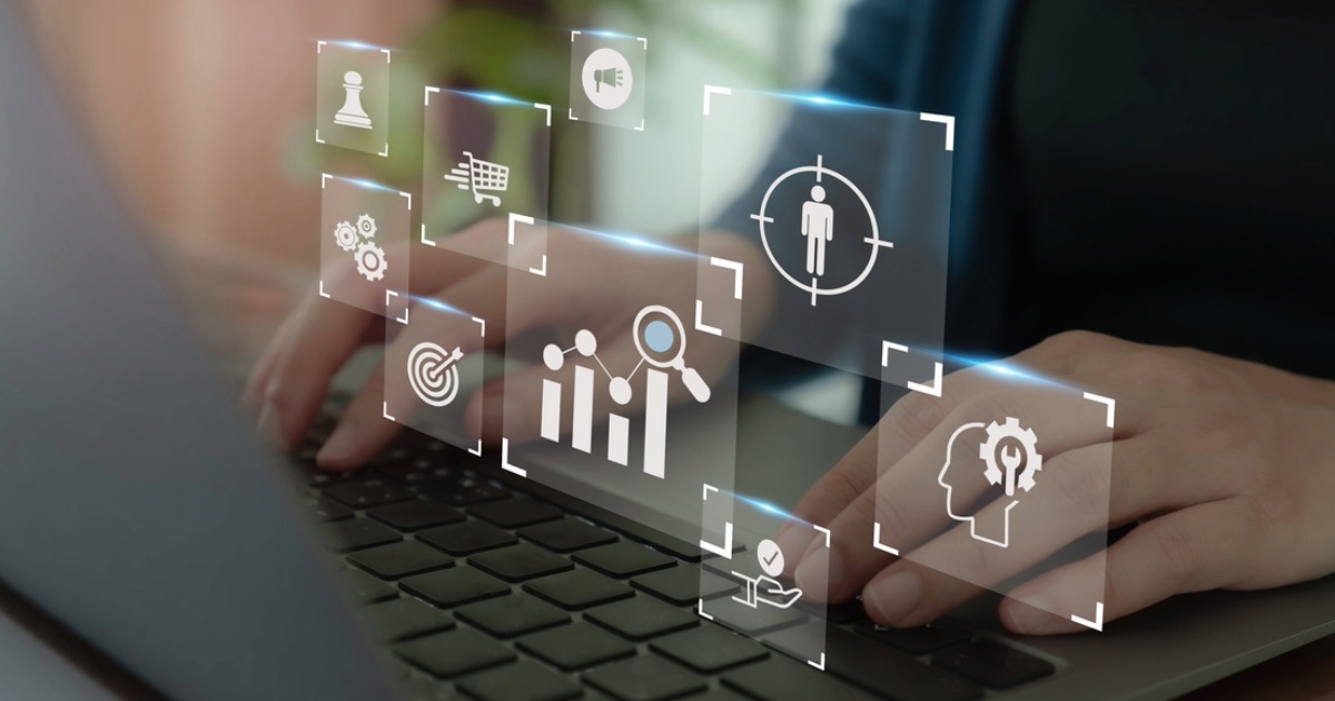 Professional typing on a laptop, using B2B ecommerce personalization strategies with support from a web development agency