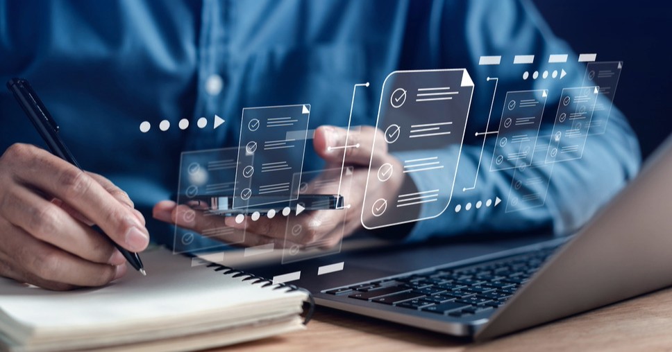 Person reviewing DXP Sitecore composable platform and Sitecore demo site on devices, showcasing successful Sitecore tech stack