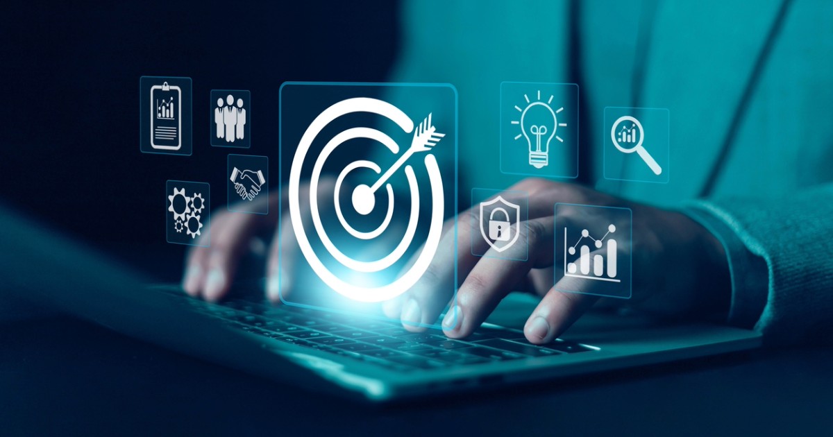 Person on a laptop analyzing data driven marketing strategies and insights for retargeting advertising based on user intent