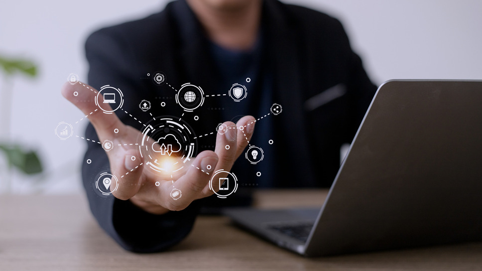 Person using laptop displaying DXP interface and features, signifying business success with Sitecore SaaS agency solutions