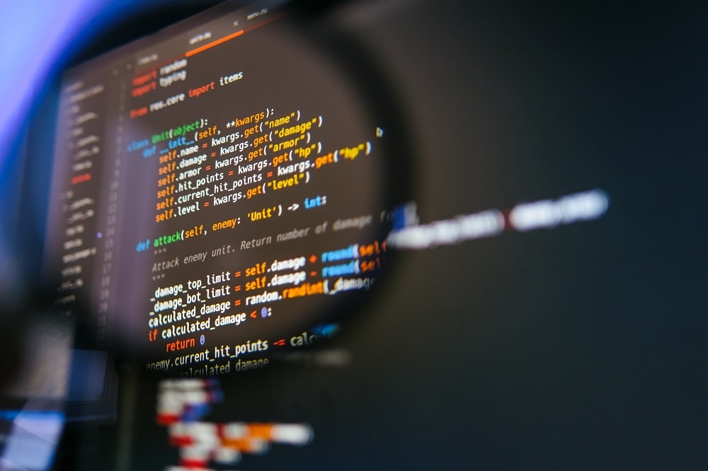 Magnifying glass over computer code