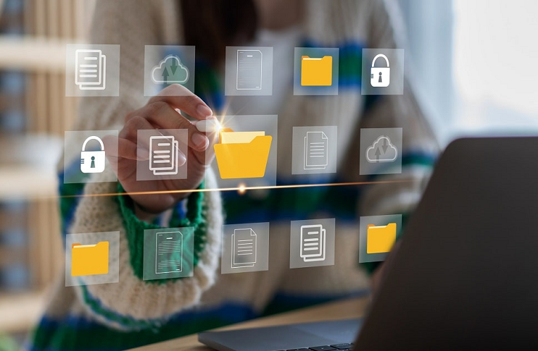 Person using a touch screen interface with icons for documents, folders, locks, and clouds, symbolizing digital file management and security.