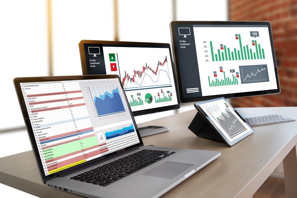 desktop, laptop, and ipad showing website data