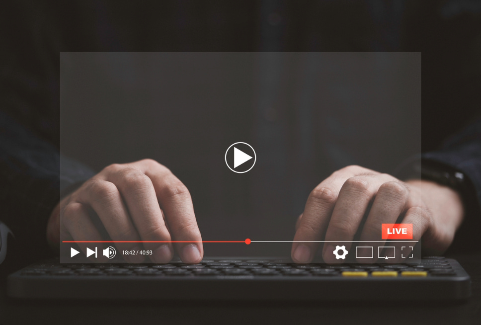 Person streaming live video content on a laptop, highlighting business success with compelling video content