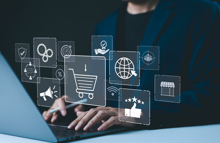 Person reviewing online business strategies for ecommerce website on laptop, symbolizing success with web development agency