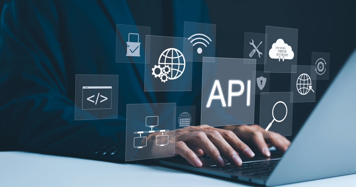 Developer using laptop to code a website with headless commerce architecture, depicting success with web development services