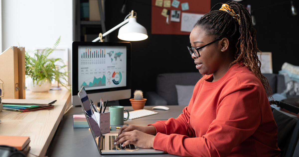 Professional on a laptop with analytics dashboard, representing Core Web Vitals, website performance, and SEO optimization.