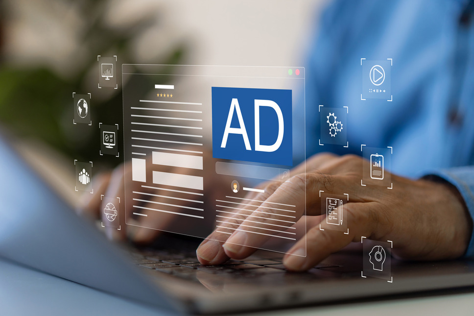 Person reviewing online advertisement performance within ad platform interface, representing success with PPC agency services