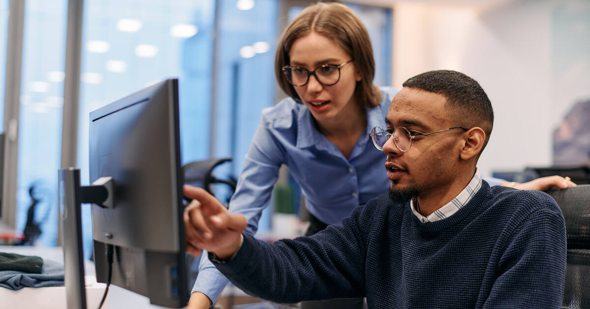 Team members collaborating on a Liferay implementation project, illustrating solution partner expertise and platform strategy