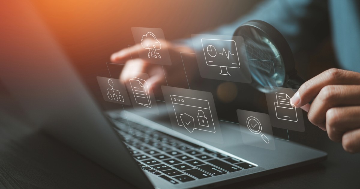 Person on a laptop, reviewing Sitecore XP benefits for website performance, security, cloud hosting, and marketing features