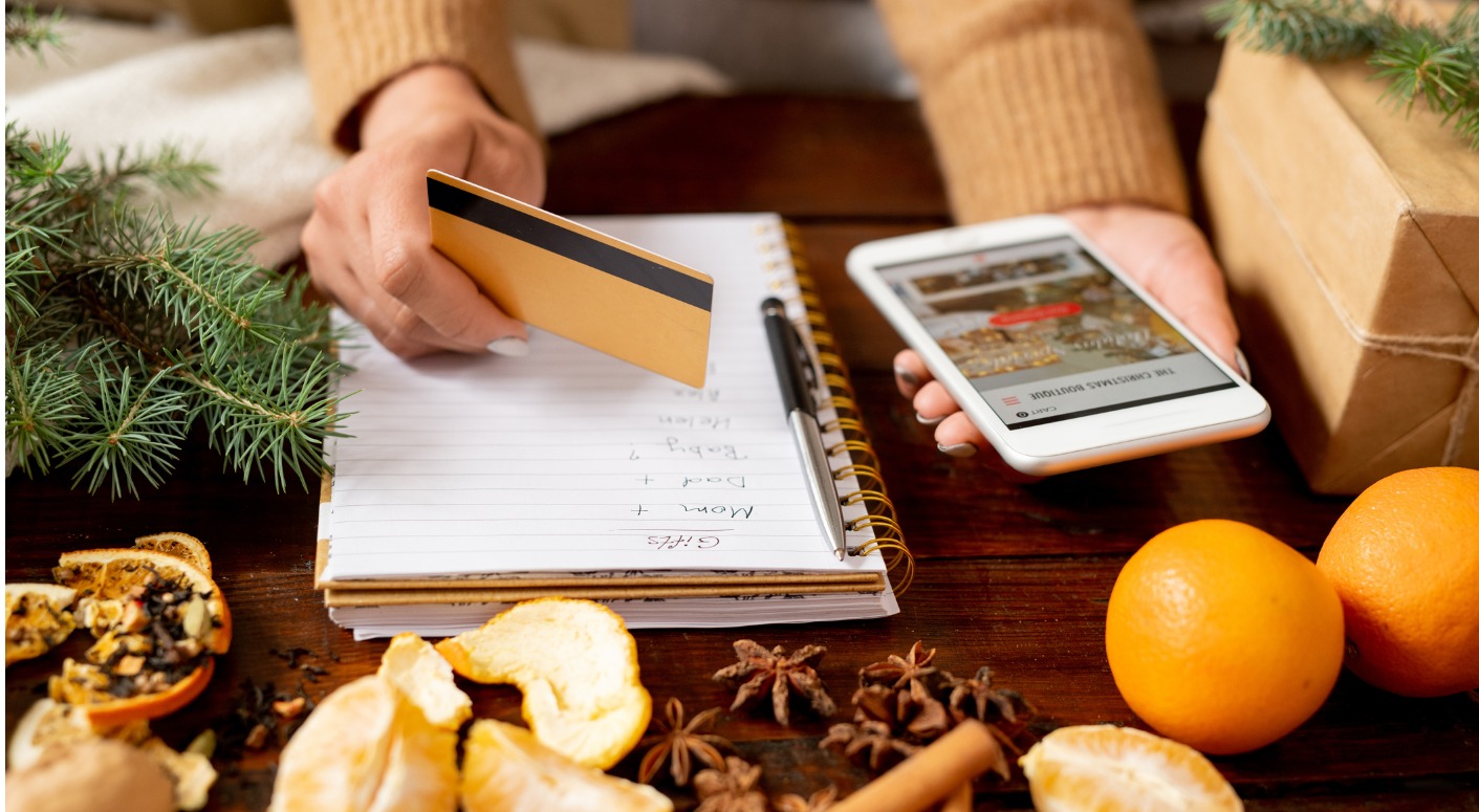 young-female-customer-with-credit-card-and-smartphone-going-to-order