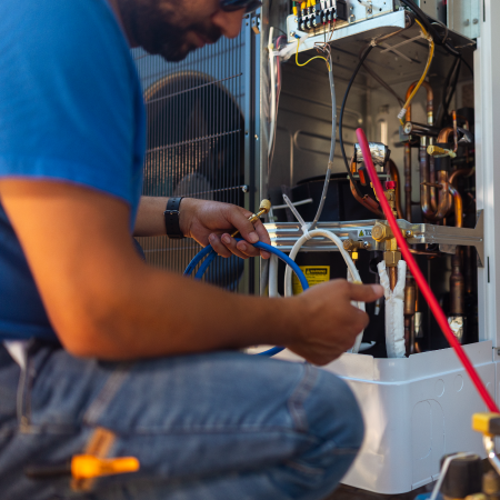 HVAC technician servicing equipment, reflecting Coburn’s successful B2B ecommerce transformation with digital agency services