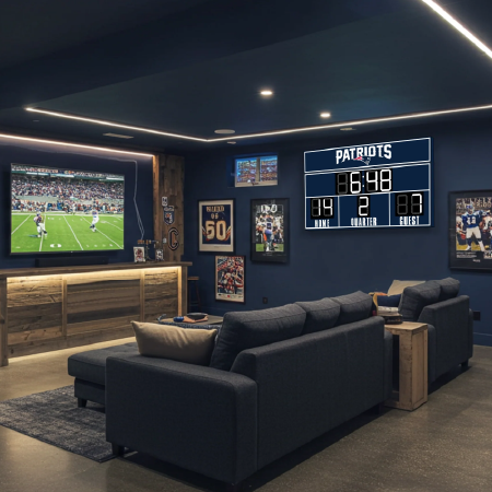 Sports-themed lounge with large TV and digital scoreboard, depicting immersive fan experiences with technology solutions