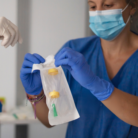 Healthcare worker opening sterile packaging indicating success with digital marketing services for medical packaging industry